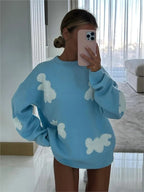 Women's knitted jumper with scattered contrasting motifs