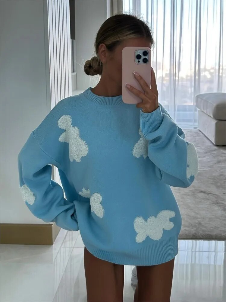 Women's knitted jumper with scattered contrasting motifs