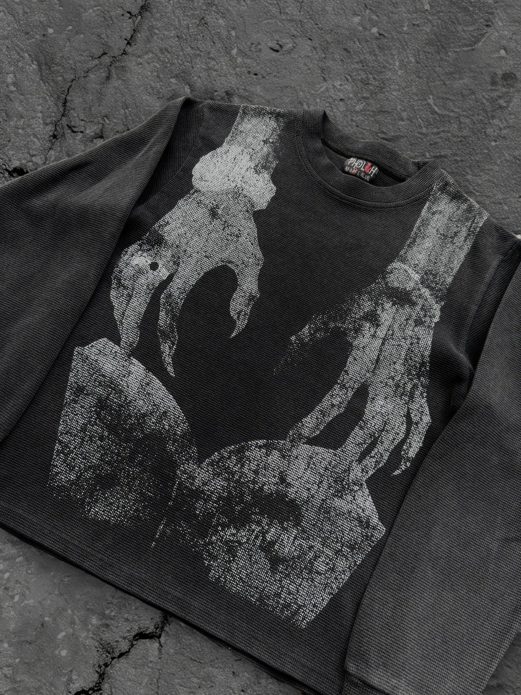 Dark graphic sweatshirt with contrasting front figure design