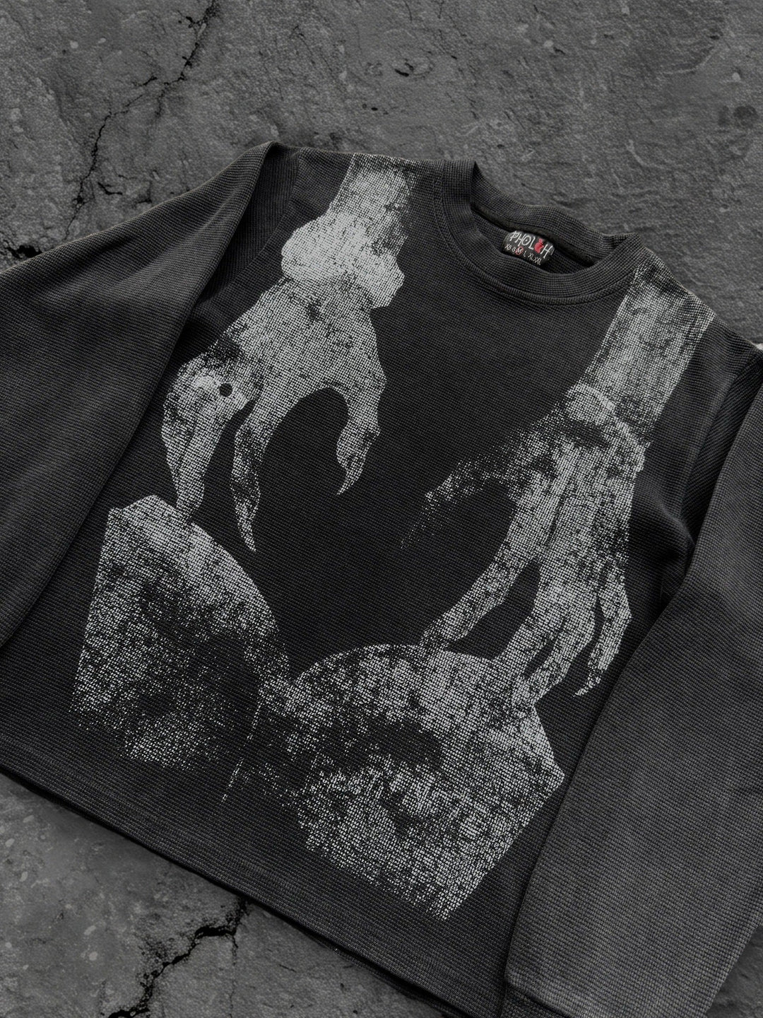 Dark graphic sweatshirt with contrasting front figure design