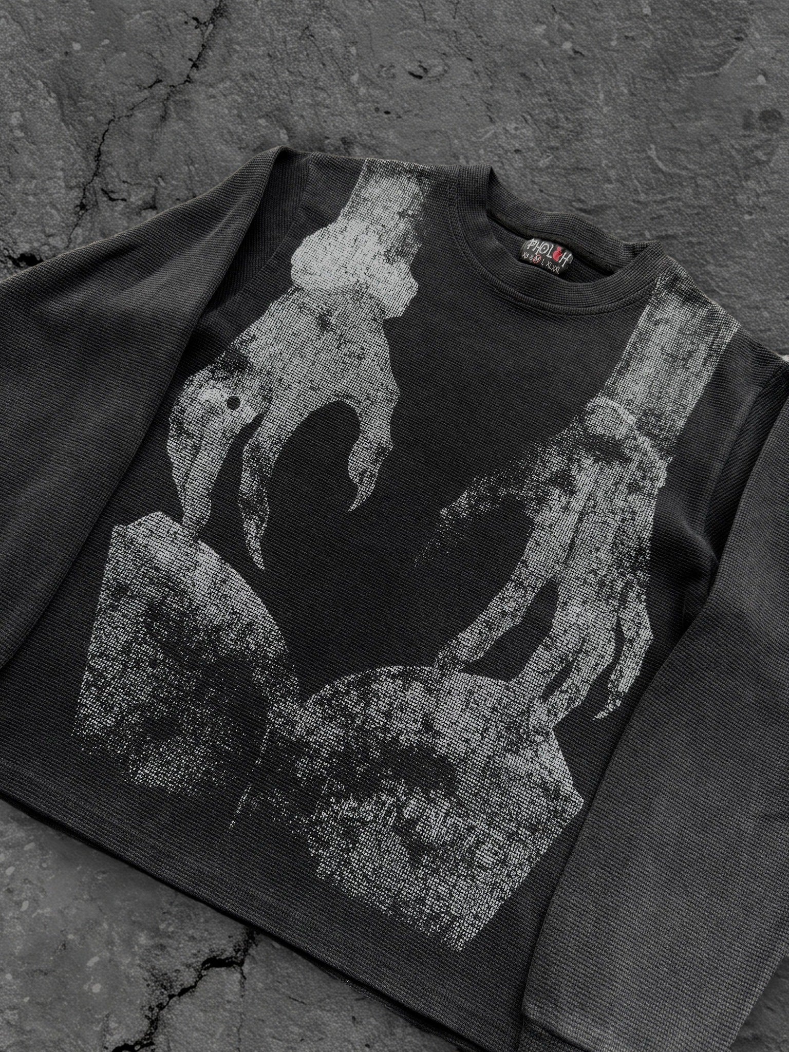 Dark graphic sweatshirt with contrasting front figure design