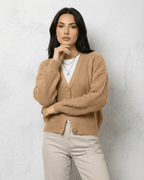 Women's textured V-neck cardigan with pearl-style trim and buttons