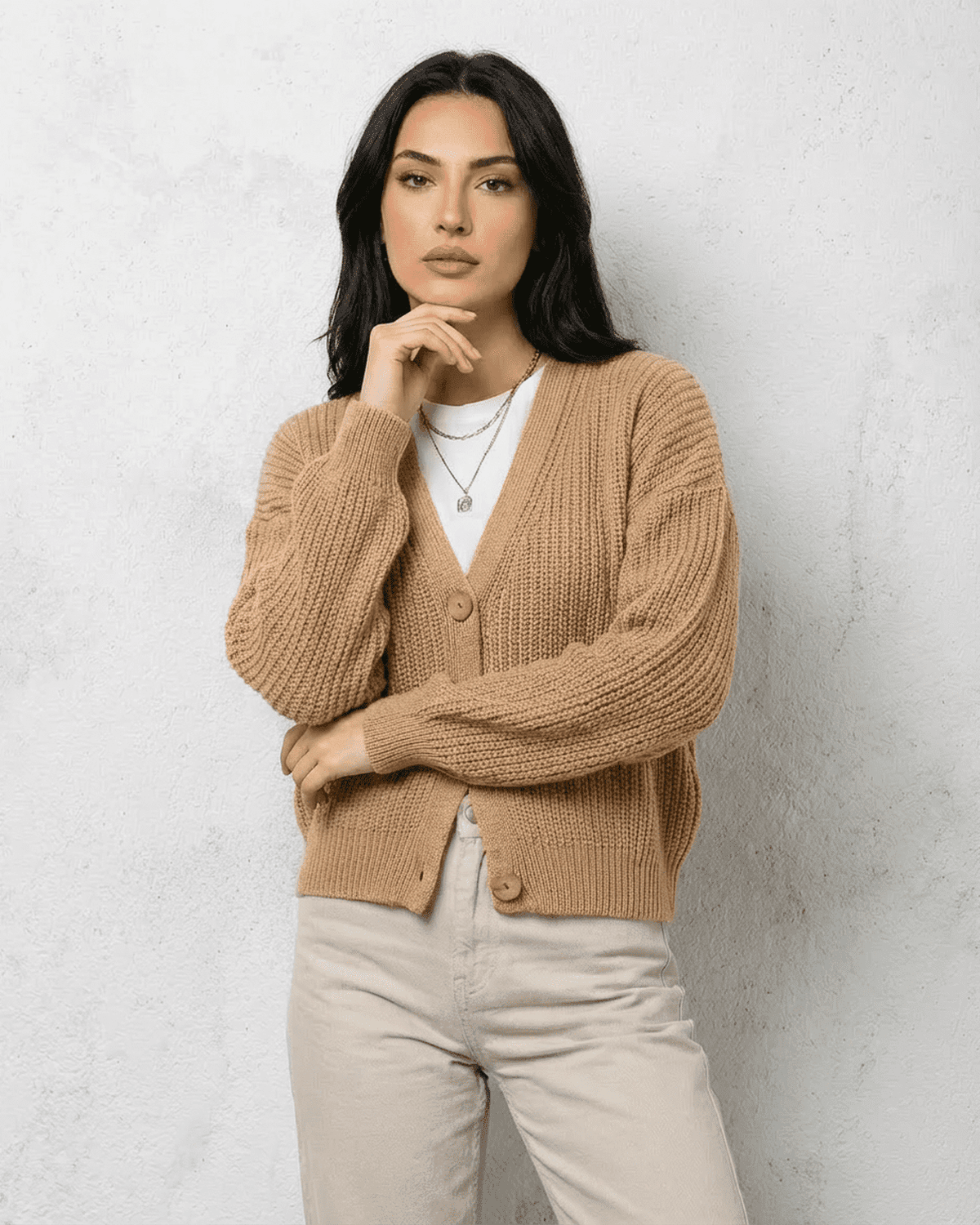 Women's textured V-neck cardigan with pearl-style trim and buttons