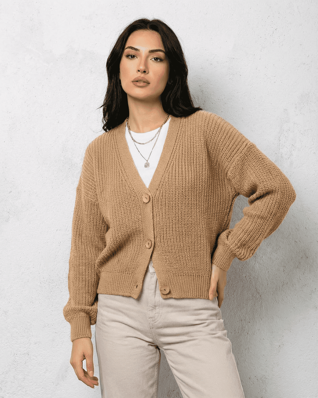 Women's textured V-neck cardigan with pearl-style trim and buttons