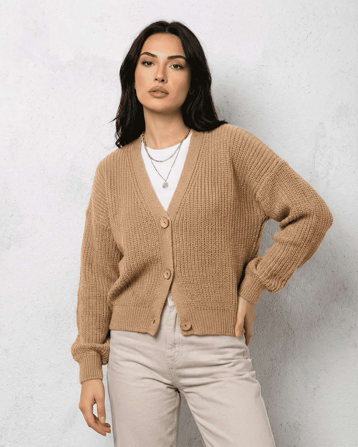 Women's textured V-neck cardigan with pearl-style trim and buttons