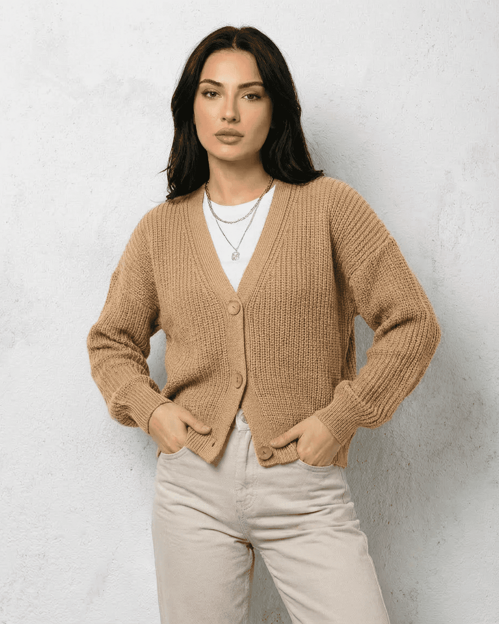 Women's textured V-neck cardigan with pearl-style trim and buttons