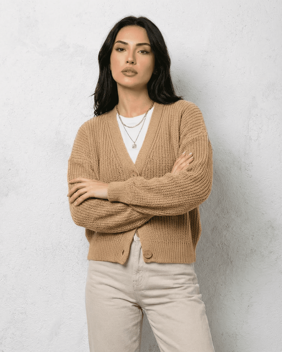Women's textured V-neck cardigan with pearl-style trim and buttons