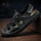 Men's outdoor walking sandal with velcro straps and mesh panels in black and green