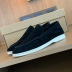 Men's slip-on loafers with textured uppers, moc toe stitching and white flat soles