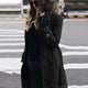 Women's long belted double-breasted trench coat with raised collar and cuff straps