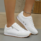 Women's lace-up trainers with contrast panels and treaded soles