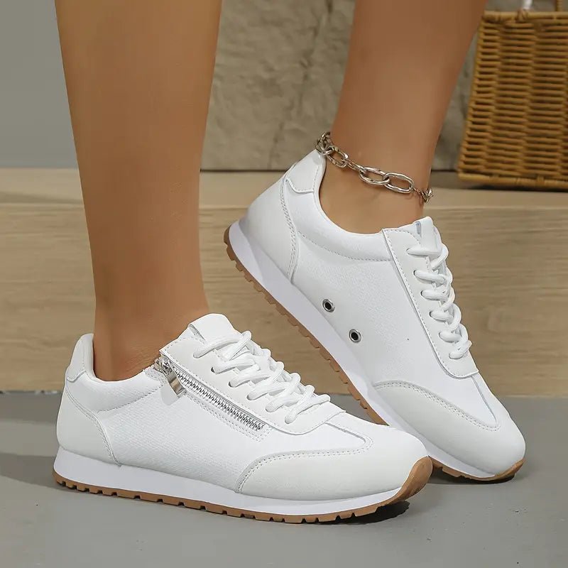 Women's lace-up trainers with contrast panels and treaded soles