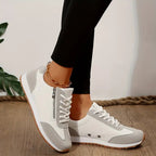 Women's lace-up trainers with contrast panels and treaded soles