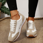 Women's lace-up trainers with contrast panels and treaded soles