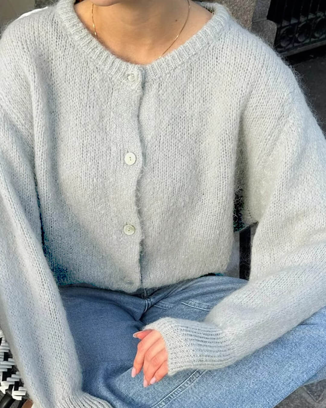 Women's fuzzy knit cardigan with crew neckline, button front and long sleeves