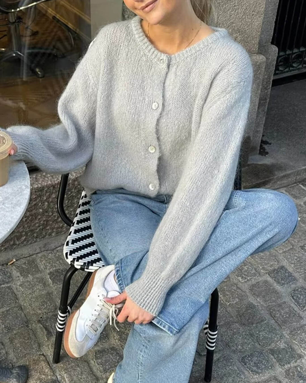 Women's fuzzy knit cardigan with crew neckline, button front and long sleeves