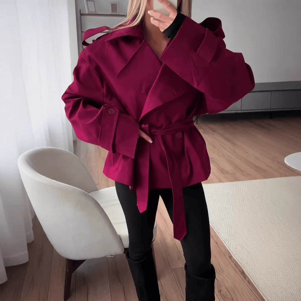 Women's cropped belted trench coat with wide lapels and long sleeves