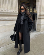 Women's long belted double-breasted coat with notched lapels
