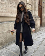 Women's long belted double-breasted coat with notched lapels