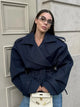Women's cropped belted trench coat with wide lapels and long sleeves