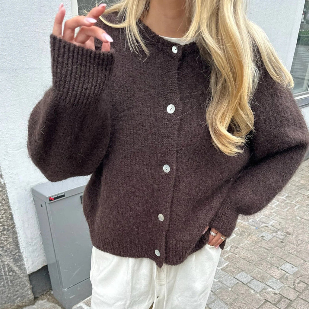 Women's fuzzy knit cardigan with crew neckline, button front and long sleeves