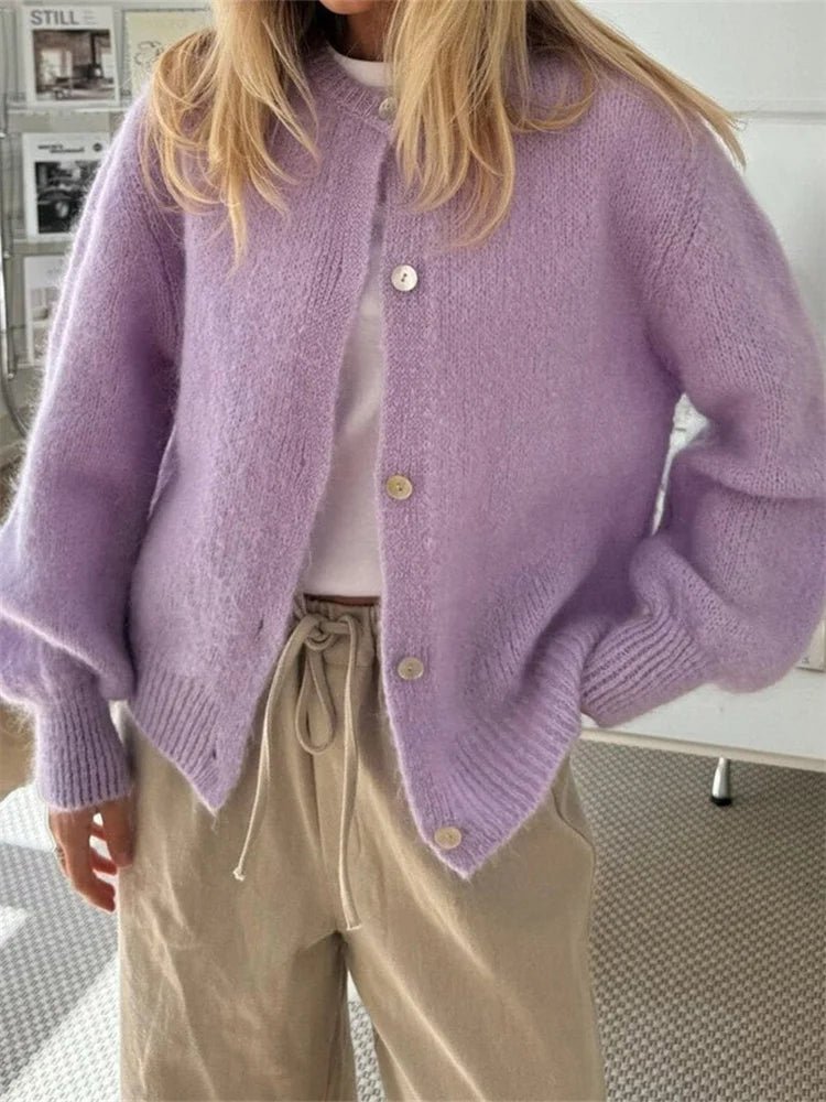 Women's fuzzy knit cardigan with crew neckline, button front and long sleeves
