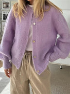Women's fuzzy knit cardigan with crew neckline, button front and long sleeves
