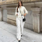 Women's white knit cardigan with lace front panels and long sleeves
