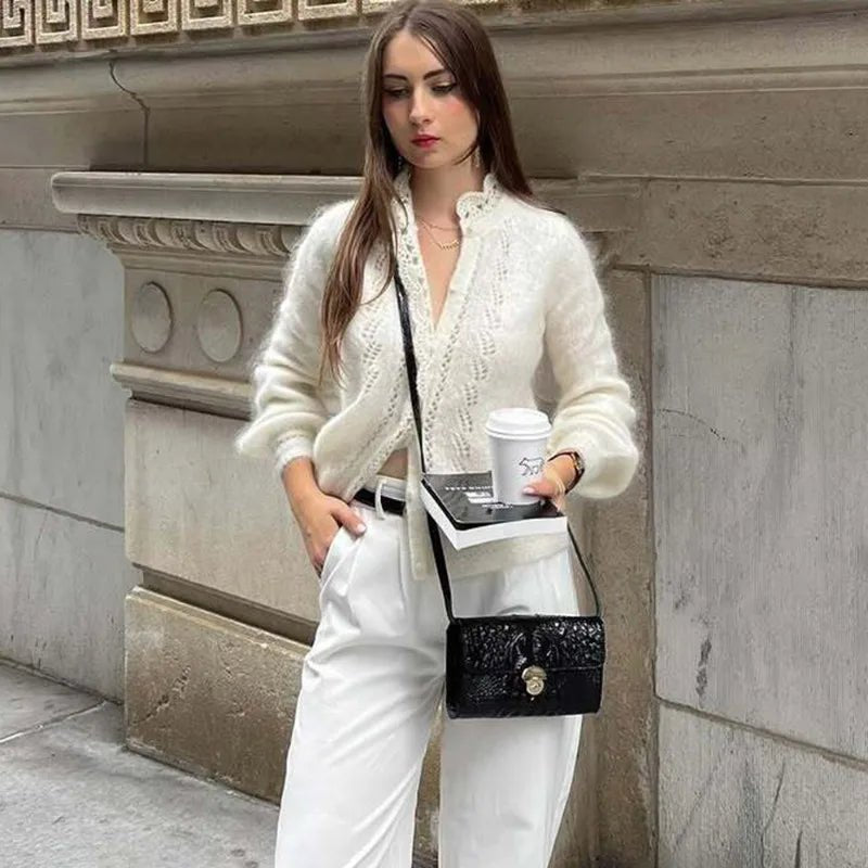 Women's white knit cardigan with lace front panels and long sleeves