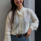 Women's white knit cardigan with lace front panels and long sleeves