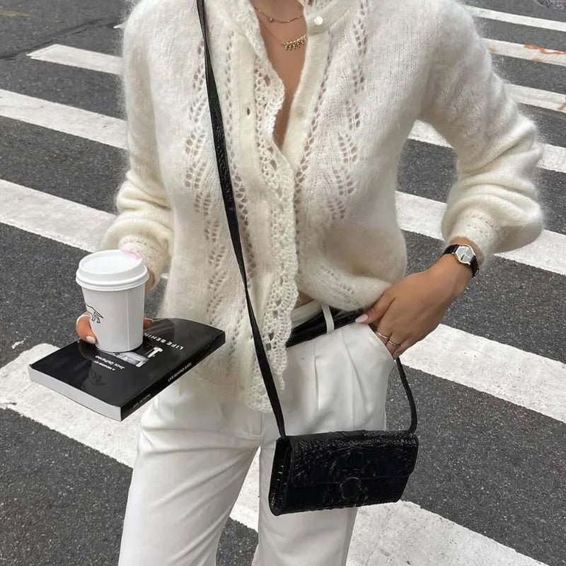 Women's white knit cardigan with lace front panels and long sleeves