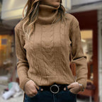Women's cable knit turtleneck sweater with long sleeves and ribbed trims