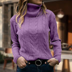 Women's cable knit turtleneck sweater with long sleeves and ribbed trims