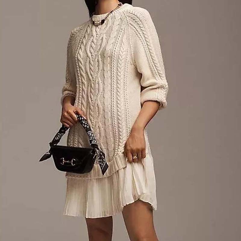 Women's cable knit mini dress with long sleeves and pleated lower skirt