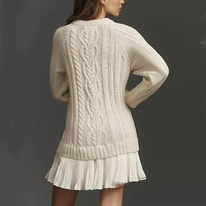 Women's cable knit mini dress with long sleeves and pleated lower skirt