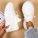 Women's orthopedic knit sneakers with lace-up front and ridged sole