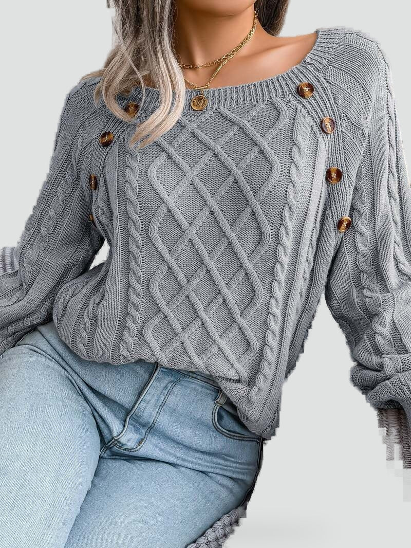 Women's cable knit sweater with diamond pattern and shoulder buttons