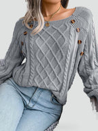 Women's cable knit sweater with diamond pattern and shoulder buttons