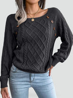 Women's cable knit sweater with diamond pattern and shoulder buttons
