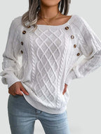 Women's cable knit sweater with diamond pattern and shoulder buttons