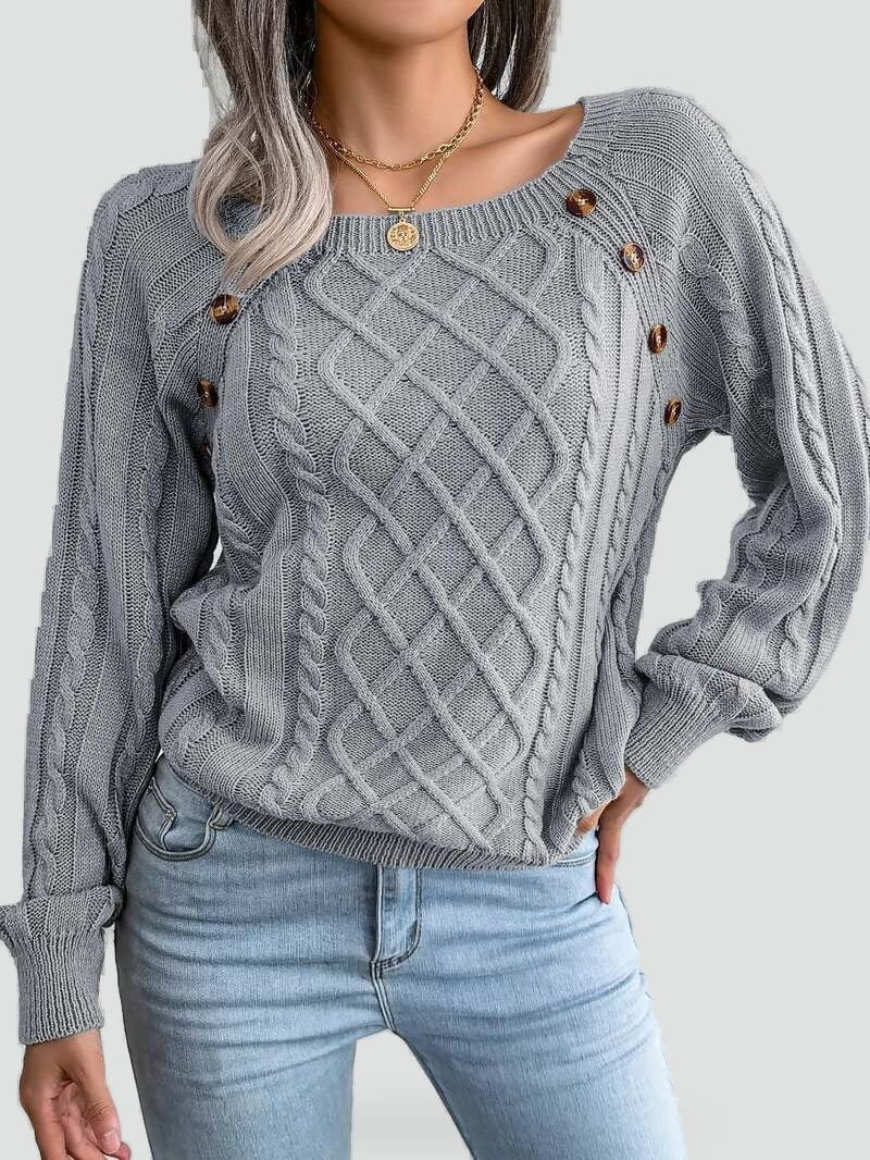 Women's cable knit sweater with diamond pattern and shoulder buttons