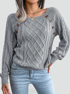 Women's cable knit sweater with diamond pattern and shoulder buttons