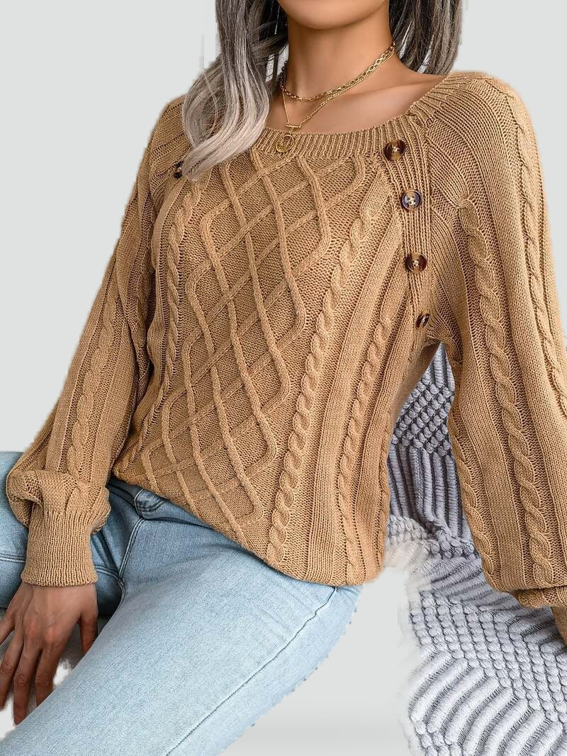 Women's cable knit sweater with diamond pattern and shoulder buttons