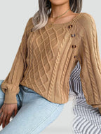Women's cable knit sweater with diamond pattern and shoulder buttons