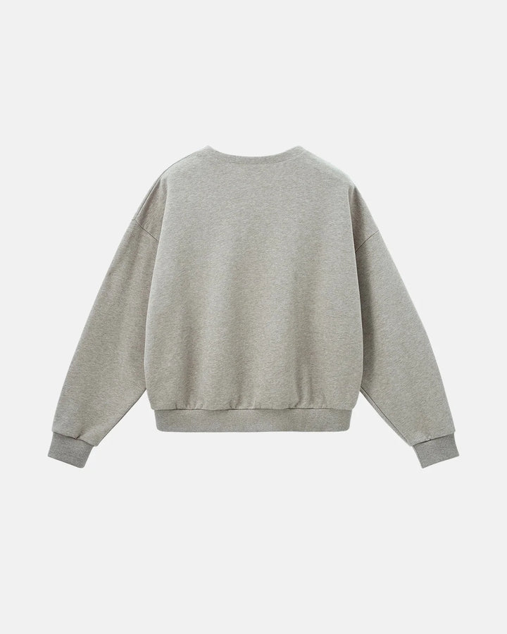Boxy long sleeve Henley collar sweatshirt with ribbed cuffs and hem