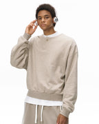 Boxy long sleeve Henley collar sweatshirt with ribbed cuffs and hem