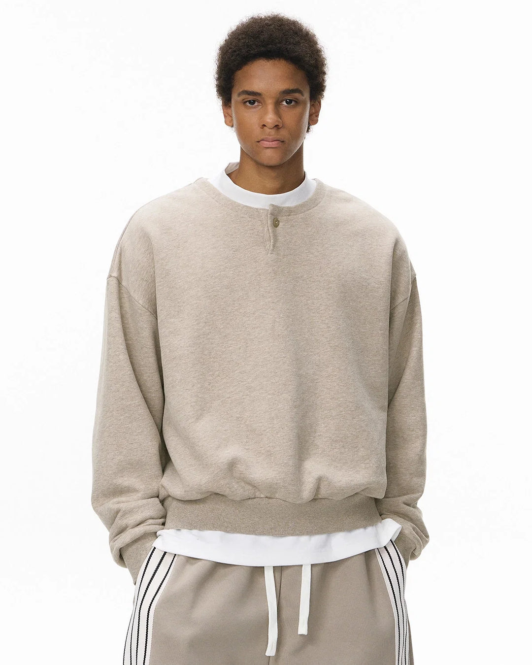 Boxy long sleeve Henley collar sweatshirt with ribbed cuffs and hem