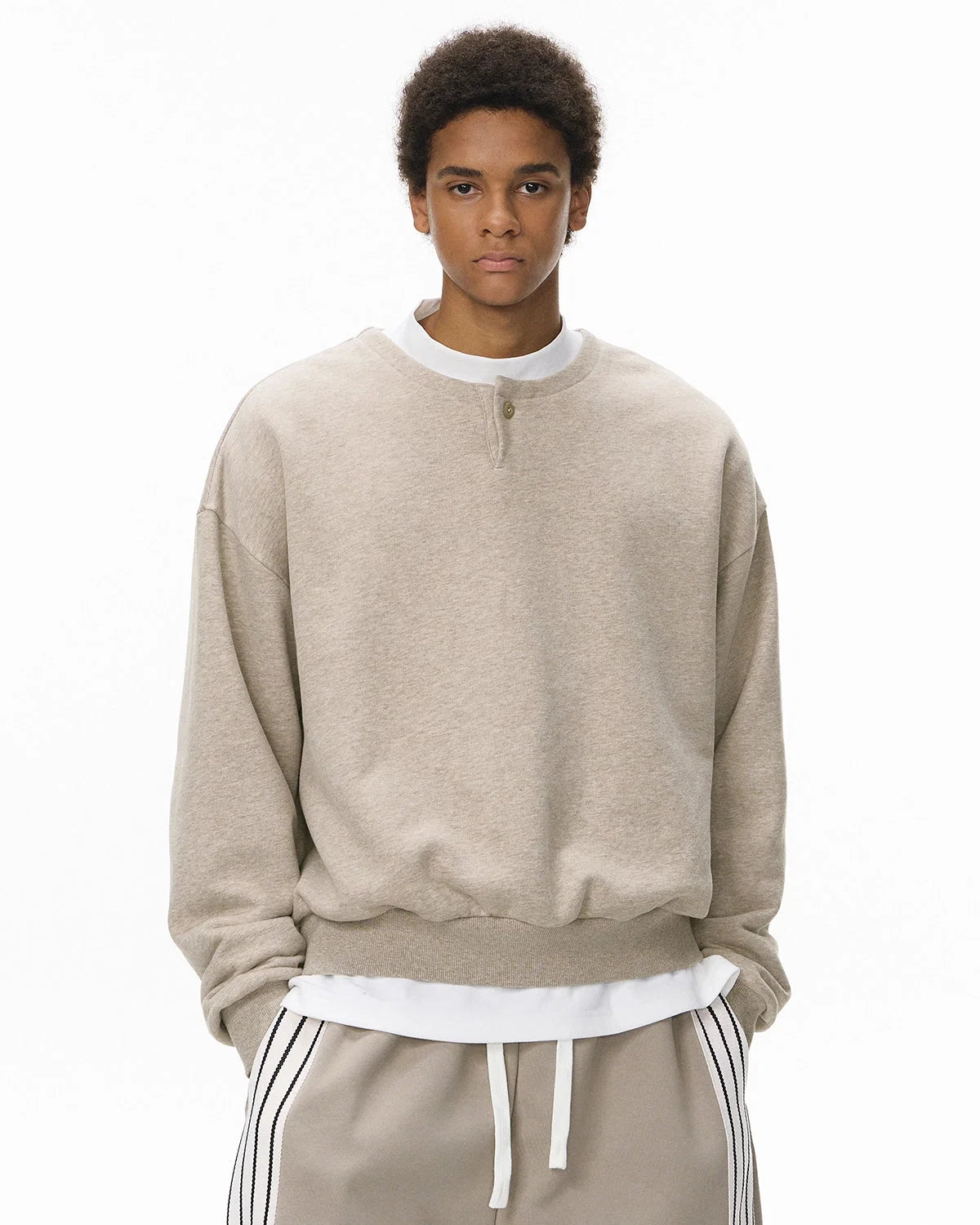 Boxy long sleeve Henley collar sweatshirt with ribbed cuffs and hem