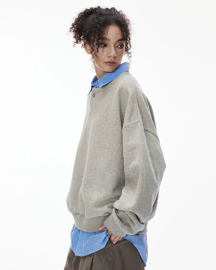 Boxy long sleeve Henley collar sweatshirt with ribbed cuffs and hem