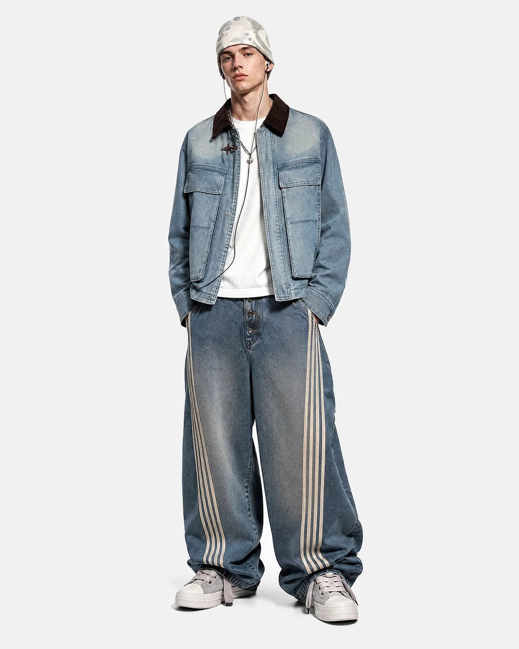 Blue boxy denim jacket with dark corduroy collar, long sleeves and multiple front pockets